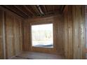 Interior framing of a room with a large window and wooded views at 1975 Sage Lake Bend Sw, Marietta, GA 30064