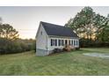 House with vinyl siding, a dark roof and plenty of green space at 4948 Emmett Still Rd, Loganville, GA 30052