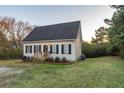 Charming one-story house with black shutters, wooden steps, and a grassy lawn at 4948 Emmett Still Rd, Loganville, GA 30052