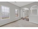 Spacious living room with hardwood floors and neutral walls at 722 Sedgwick Dr, Jonesboro, GA 30238