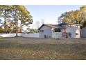 Side view of a gray brick house with fenced backyard at 1580 Hampshire Pl, Decatur, GA 30032