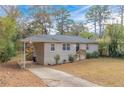 Newly painted ranch home with a carport at 2479 Brentwood Rd, Decatur, GA 30032