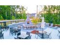 Outdoor kitchen, fireplace, and seating area in the community at 979 Blue Juniper Cir, Loganville, GA 30052