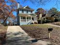 Exterior view of a light blue house with driveway leading to the front entrance at 941 Capitol View Ave, Atlanta, GA 30318