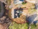 An aerial view of a residential property, showing the roof, driveway, and surrounding trees at 264 Creek View Pl, Canton, GA 30114