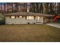 Single-story home with a covered entrance and driveway at dusk at 2579 Bonnybrook Sw Dr, Atlanta, GA 30311