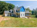 Side view of a two-story home under construction with a wrap-around porch at 772 Old Lathemtown And 776 Rd, Canton, GA 30115