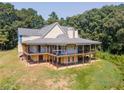Back view of a home under construction with a large covered deck at 772 Old Lathemtown And 776 Rd, Canton, GA 30115
