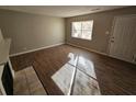 Living room with wood-look flooring, fireplace, and entryway at 926 Westland Dr, Marietta, GA 30064