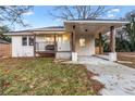 Newly renovated home with a covered carport and landscaping at 1819 Pennington Se Pl, Atlanta, GA 30316