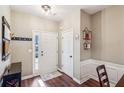 Bright and airy entryway with wood floors and built-in shelving at 241 Kigian Trl, Woodstock, GA 30188