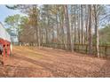 Spacious, fenced backyard with trees at 1463 Wood Park Nw Way, Kennesaw, GA 30152