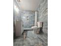 Modern bathroom with blue tile, a white vanity, and a shower with a glass door at 1393 Bolton Nw Rd, Atlanta, GA 30331