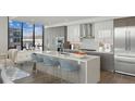 Modern kitchen with island, stainless steel appliances, and city views at 2425 Peachtree Ne Rd # 510, Atlanta, GA 30305