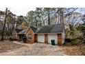 Brick ranch home with a two-car garage and driveway at 3419 Wesley Chapel Rd, Decatur, GA 30034