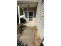 Welcoming front porch with a covered entryway and pumpkins at 2419 Centennial Hill Way Nw Nw Way, Acworth, GA 30102