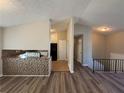 Living room with new flooring and view to tiled kitchen at 2326 Union Grove Ct, Lithonia, GA 30058