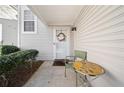 Welcoming front porch with a charming entrance and seating area at 91 Highland Falls Dr, Hiram, GA 30141