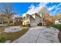 Two-story house with a large driveway and landscaped yard at 770 Glen Royal Dr, Roswell, GA 30076