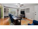 Inviting living room with hardwood floors, built-in shelves, and ample natural light at 2307 Hunting Valley Dr, Decatur, GA 30033