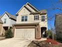 Two-story house with brick and siding, two-car garage, and landscaping at 3372 Baylor Cir, Mcdonough, GA 30253