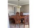 Formal dining room featuring a large wood table and chairs at 1276 Huntington Place Cir, Lithonia, GA 30058