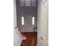 Bright entryway with hardwood floors and staircase at 1276 Huntington Place Cir, Lithonia, GA 30058