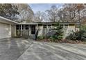 Inviting home exterior with covered entryway and attached garage at 3479 Chestnut Dr, Atlanta, GA 30340