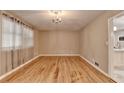 Bright living room with hardwood floors and chandelier at 3479 Chestnut Dr, Atlanta, GA 30340