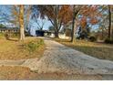 Long driveway leading to a renovated ranch-style home at 2385 Tilson Rd, Decatur, GA 30032