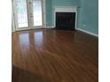 Living room with hardwood floors and fireplace at 1306 Warsaw Rd, Roswell, GA 30076