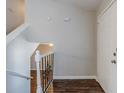 Entryway with staircase, dark brown wood-look floors, and white door at 1275 To Lani Farm Rd, Stone Mountain, GA 30083