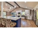 Modern kitchen with white cabinets, quartz countertops, a large island, and stainless steel appliances at 3625 Pointer Rd, Loganville, GA 30052