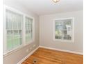Bright dining area or additional living space with large windows and hardwood floors at 2454 Spring Garden Sw Dr, Atlanta, GA 30315