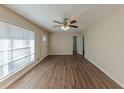 Inviting living room featuring wood-look flooring, abundant natural light, and a ceiling fan at 1852 Shamrock Dr, Decatur, GA 30032