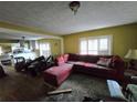 L-shaped sofa and cluttered living room at 1541 Harbin Sw Rd, Atlanta, GA 30311