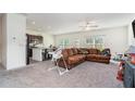 Spacious living room with brown sectional sofa and open floor plan at 9004 Jim Purcell Dr, Covington, GA 30014