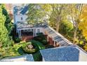 A backyard with a covered patio, fountain, and lush greenery at 2111 Cooper Lake Se Rd, Smyrna, GA 30080
