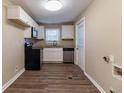 Updated kitchen featuring stainless steel appliances and wood-look flooring at 1807 Oakmont Nw Dr, Atlanta, GA 30314