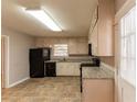Bright kitchen with granite counters and black appliances at 3457 Springlake Dr, Decatur, GA 30032