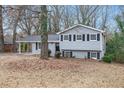 Gray house with a covered carport and a well-maintained lawn at 2625 Crestdale Se Cir, Atlanta, GA 30316