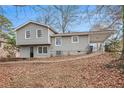 Gray house with a covered carport and a well-maintained lawn at 2625 Crestdale Se Cir, Atlanta, GA 30316