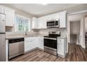 Renovated kitchen, featuring stainless steel appliances and granite countertops at 2625 Crestdale Se Cir, Atlanta, GA 30316