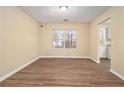 Simple dining room with hardwood floors and a window at 2329 Wilkins Cv, Decatur, GA 30035