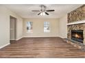 Bright living room with hardwood floors and a stone fireplace at 2329 Wilkins Cv, Decatur, GA 30035