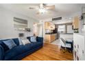 Open living room and kitchen with hardwood floors and a blue couch at 24 Daniel Se St # 8, Atlanta, GA 30312