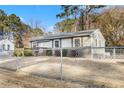 House exterior with chain link fence and yard at 1035 Stonewall Se Dr, Atlanta, GA 30315