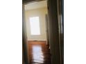 Empty bedroom with hardwood floors and a large window at 309 Fletcher Sw St, Atlanta, GA 30315