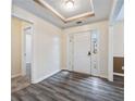 Bright entryway with grey wood-look floors at 3041 Lexington Ave, Woodstock, GA 30189