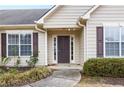 Front door entrance with dark brown door at 3041 Lexington Ave, Woodstock, GA 30189